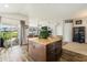 Spacious kitchen with a center island flowing into the living room providing seamless entertaining at 8217 Canterbury Lake Blvd, Tampa, FL 33619