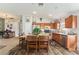Open-concept kitchen featuring a center island with barstool seating and stainless steel appliances at 8217 Canterbury Lake Blvd, Tampa, FL 33619