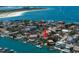 Waterfront home with dock access, lush landscaping, and stunning views of the ocean and beach at 841 Ponce De Leon Dr, St Petersburg, FL 33715