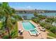 Aerial view of the backyard featuring a pool, patio, and lush landscaping with marina views at 841 Ponce De Leon Dr, St Petersburg, FL 33715