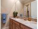 Bright bathroom with granite countertops, decorative vanity, and a modern mirror at 841 Ponce De Leon Dr, St Petersburg, FL 33715