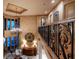 Elegant foyer with hardwood floors, a chandelier, and iron stair railing with wood trim at 841 Ponce De Leon Dr, St Petersburg, FL 33715