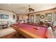 Open-concept game room with a pool table, living space, dining area, and bar that is perfect for entertaining at 841 Ponce De Leon Dr, St Petersburg, FL 33715