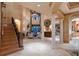 Spacious living room with fireplace, large windows, and soaring ceilings at 841 Ponce De Leon Dr, St Petersburg, FL 33715