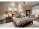 Comfortable main bedroom with plush carpeting, crown molding, and an ensuite bathroom at 841 Ponce De Leon Dr, St Petersburg, FL 33715
