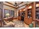 Sophisticated office with wood trim, built-in bookshelves, custom windows and ceiling fan at 841 Ponce De Leon Dr, St Petersburg, FL 33715