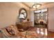 Elegant sitting area featuring hardwood floors, a stylish mirror, and comfortable seating at 841 Ponce De Leon Dr, St Petersburg, FL 33715