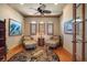Bright sitting area with hardwood floors, ceiling fan, and comfortable chairs, perfect for relaxation at 841 Ponce De Leon Dr, St Petersburg, FL 33715