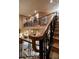 Intricate wrought iron railing detail on the staircase, overlooking an open floor plan at 841 Ponce De Leon Dr, St Petersburg, FL 33715