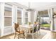 Bright dining room with backyard access, abundant natural light, and contemporary furnishings at 8460 Capstone Ranch Dr, New Port Richey, FL 34655