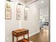 Tastefully decorated hallway with hardwood floors and decorative wall art at 8460 Capstone Ranch Dr, New Port Richey, FL 34655