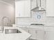Modern kitchen with stainless steel appliances, quartz counters, and stylish backsplash at 8460 Capstone Ranch Dr, New Port Richey, FL 34655