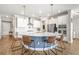 Gourmet kitchen with stainless steel appliances, a large center island and modern pendant lighting at 8460 Capstone Ranch Dr, New Port Richey, FL 34655