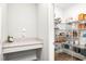 Walk-in pantry with wire shelving and countertop space for storage at 8460 Capstone Ranch Dr, New Port Richey, FL 34655