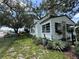 Exterior shot of a home with beautiful manicured landscaping at 8502 N Branch Ave, Tampa, FL 33604