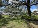 Home featuring a 'Beware of Dog' sign with manicured front yard and fence at 8502 N Branch Ave, Tampa, FL 33604