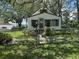 Home featuring a 'Beware of Dog' sign with manicured front yard and fence at 8502 N Branch Ave, Tampa, FL 33604