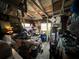 Rustic garage interior filled with various tools, equipment, and storage items at 8502 N Branch Ave, Tampa, FL 33604