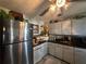 Functional kitchen with stainless steel refrigerator and ample cabinet space at 8502 N Branch Ave, Tampa, FL 33604