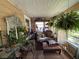 Cozy sunroom featuring comfortable seating and ample natural light, perfect for relaxation at 8502 N Branch Ave, Tampa, FL 33604