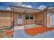 Inviting front porch features decorative ironwork and tiled flooring to welcome you home at 9100 Lunar Ln, Port Richey, FL 34668