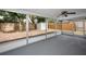 This screened porch offers a nice view of the fenced back yard with a storage shed at 9100 Lunar Ln, Port Richey, FL 34668