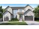 Stunning two-story home featuring a stone facade, modern windows, and a well-manicured lawn at 924 42Nd N Ave, St Petersburg, FL 33703