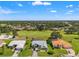 An aerial view of luxury homes in a golf course community with lush landscaping and mature trees at 9276 Ashley Dr, Weeki Wachee, FL 34613