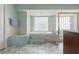 Bathroom suite with large soaker tub, separate shower, and ample natural light at 9276 Ashley Dr, Weeki Wachee, FL 34613