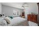 This bright bedroom features tile flooring, natural light and a ceiling fan at 9276 Ashley Dr, Weeki Wachee, FL 34613