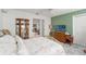 Bright bedroom features a large bed, tile flooring and a TV with lots of natural light at 9276 Ashley Dr, Weeki Wachee, FL 34613