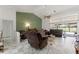 Comfortable living area featuring tile floors, recessed lighting, and a view of the backyard at 9276 Ashley Dr, Weeki Wachee, FL 34613
