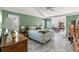 Spacious bedroom with tray ceilings, tiled flooring, and neutral colored walls at 9276 Ashley Dr, Weeki Wachee, FL 34613