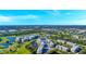 Wide aerial panorama showcasing condos amidst lush landscapes, golf courses, and serene waterways at 960 Starkey Rd # 9104, Largo, FL 33771