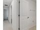 Hallway featuring neutral paint and tile flooring at 9828 Branching Ship Trace, Wesley Chapel, FL 33545