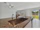 Kitchen with granite countertops, stainless steel sink, and stainless steel faucet at 9828 Branching Ship Trace, Wesley Chapel, FL 33545