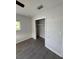 Bedroom featuring wood-look flooring, a closet, and a window with a view to the exterior at 6034 Bayou Grande Ne Blvd, St Petersburg, FL 33703