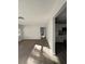 Open-concept living space with wood floors flowing into an adjacent room at 6034 Bayou Grande Ne Blvd, St Petersburg, FL 33703