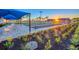 Well maintained bocce ball courts with landscaping, seating, and covered picnic tables at 10486 Sea Breeze Ridge Dr, Englewood, FL 34223