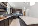 Beautiful kitchen with stainless steel appliances, a center island and tiled backsplash at 10486 Sea Breeze Ridge Dr, Englewood, FL 34223