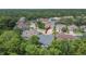 Aerial view of the back of the house showing backyard features, landscaping, and neighborhood at 10515 Canary Isle Dr, Tampa, FL 33647
