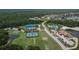 Aerial view of community sports facilities including tennis courts, sports field, and pool area at 10515 Canary Isle Dr, Tampa, FL 33647