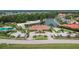 Stunning aerial view of the beach club, pool, and surrounding community near the lake at 10515 Canary Isle Dr, Tampa, FL 33647