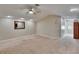 Spacious basement featuring ceiling fan, recessed lighting, and adjacent hallway at 10515 Canary Isle Dr, Tampa, FL 33647