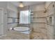 Bathroom features a stand alone tub and separate shower with tile surround at 10515 Canary Isle Dr, Tampa, FL 33647
