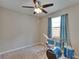 Bedroom with a ceiling fan, window, and blue drum set at 10515 Canary Isle Dr, Tampa, FL 33647