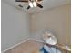Bedroom with ceiling fan and drumset at 10515 Canary Isle Dr, Tampa, FL 33647