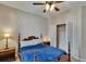 Bedroom with a ceiling fan, wood furniture, and a closet at 10515 Canary Isle Dr, Tampa, FL 33647