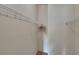 Empty walk-in closet with metal shelving for clothing storage at 10515 Canary Isle Dr, Tampa, FL 33647