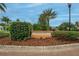 Well-maintained Canary Isle community entrance sign with landscaping and inviting curb appeal at 10515 Canary Isle Dr, Tampa, FL 33647